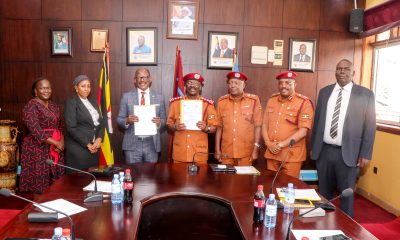 The Vice Chancellor-Prof. Barnabas Nawangwe (3rd Left) and Commissioner General Uganda Prisons Service (UPS)-Dr. Johnson Byamugisha (Centre) flanked by Left to Right: Dr. Patricia Atim, Dr. Zahara Nampewo and UPS Officials show off the signed MoU on 10th December 2024. Makerere University and Uganda Prison Services (UPS) sign Memorandum of Understanding that paves way for Makerere University School of Law to undertake short trainings in administrative law for UPS staff, 10th December 2024, Kampala Uganda, East Africa.