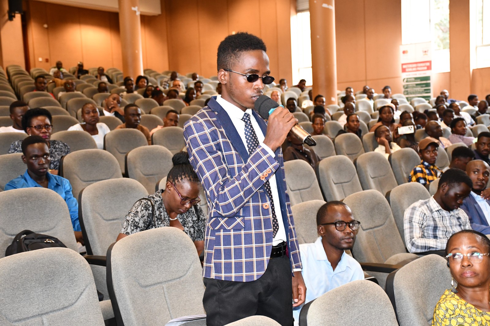 A student with visual impairment participating in a discussion during the International Day for PWDs held recently at Makerere University, Kampala Uganda, East Africa.