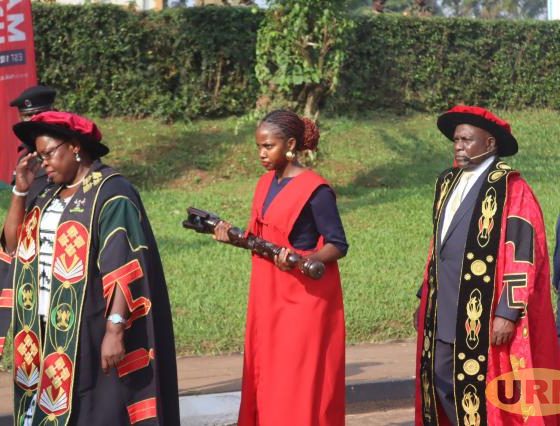 Minister Moriku Kadducu and the new University Chancellor, Dr. Crispus Kiyonga (at the back), during the academic procession at Makerere University. Kampala Uganda, East Africa.