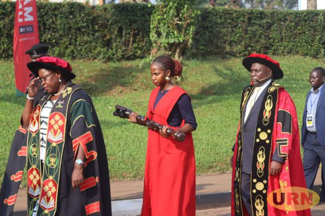 Minister Moriku Kadducu and the new University Chancellor, Dr. Crispus Kiyonga (at the back), during the academic procession at Makerere University. Kampala Uganda, East Africa.