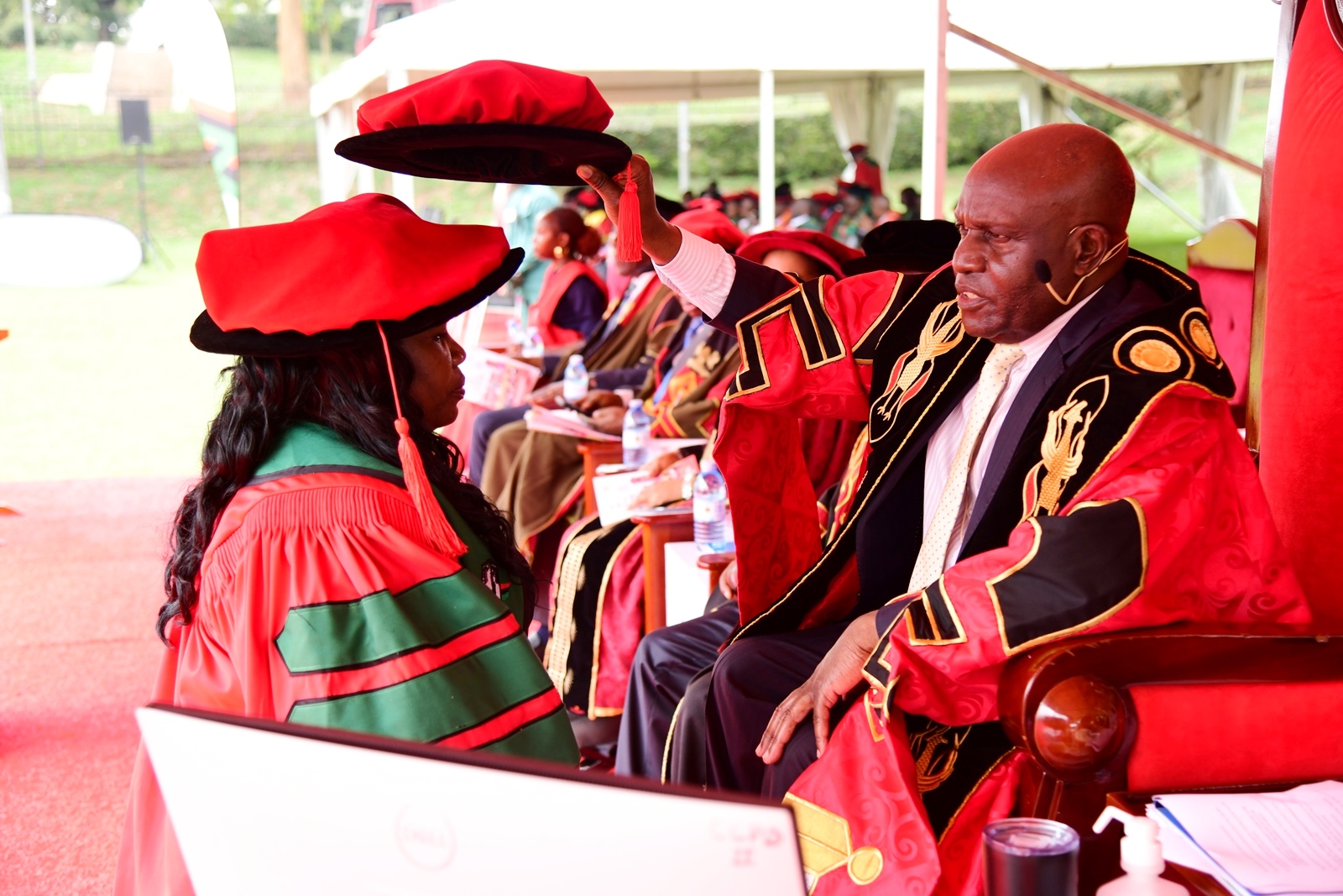 Hon. Dr. Crispus Kiyonga confers a PhD upon Dr. Irene Namatende from the College of Education and External Studies (CEES). 75th Graduation Ceremony, Day 1, CoCIS, CEES, CoVAB and School of Law. 13th January 2025, Freedom Square, Makerere University, Kampala Uganda, East Africa.