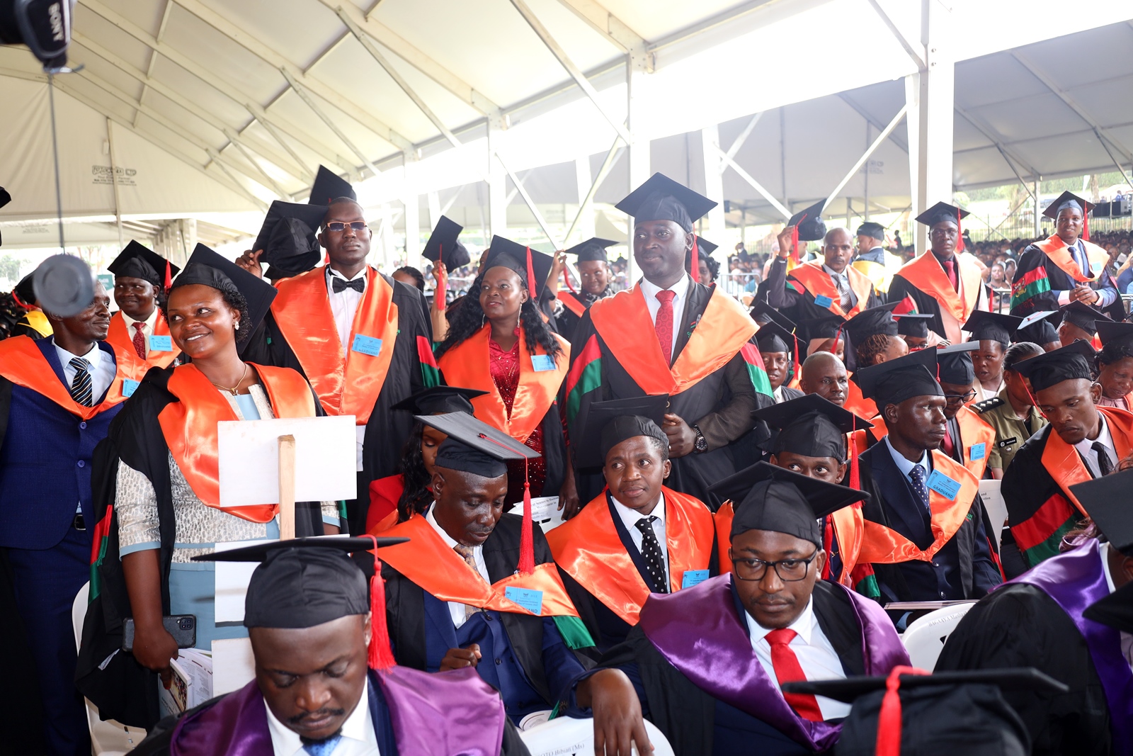 Masters Graduates from CEES stand to receive their awards. 75th Graduation Ceremony, Day 1, CoCIS, CEES, CoVAB and School of Law. 13th January 2025, Freedom Square, Makerere University, Kampala Uganda, East Africa.