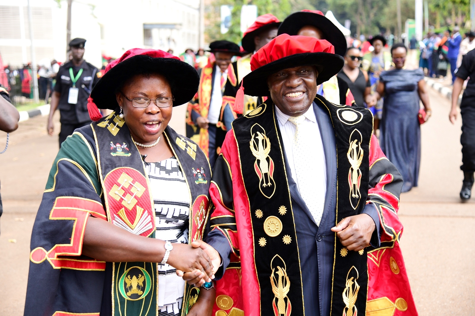 Hon. Dr. Joyce Moriku Kaducu and Hon. Dr. Crispus Kiyonga share a light moment. 75th Graduation Ceremony, Day 1, CoCIS, CEES, CoVAB and School of Law. 13th January 2025, Freedom Square, Makerere University, Kampala Uganda, East Africa.