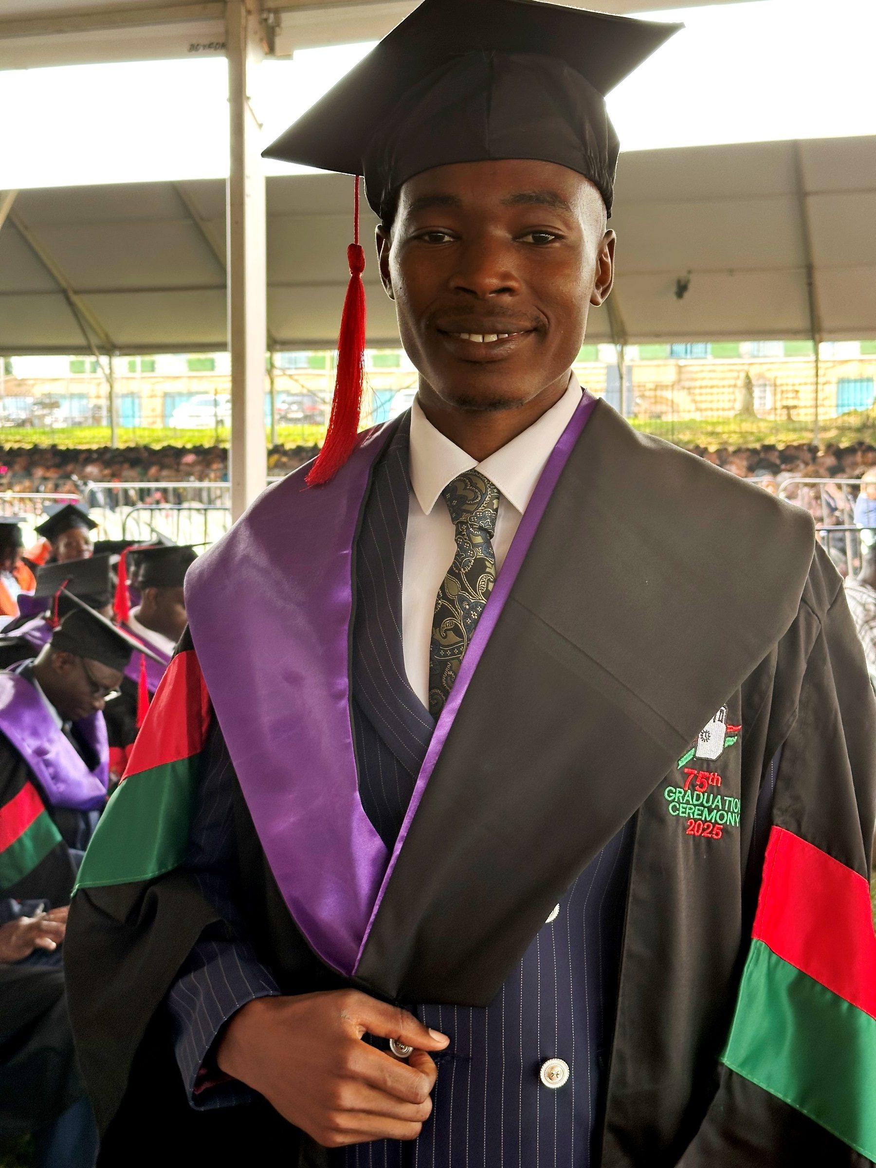 Mr. Alado Lawrence, best performing LLB student who attained a 1st Class degree. 75th Graduation Ceremony, Day 1, CoCIS, CEES, CoVAB and School of Law. 13th January 2025, Freedom Square, Makerere University, Kampala Uganda, East Africa.