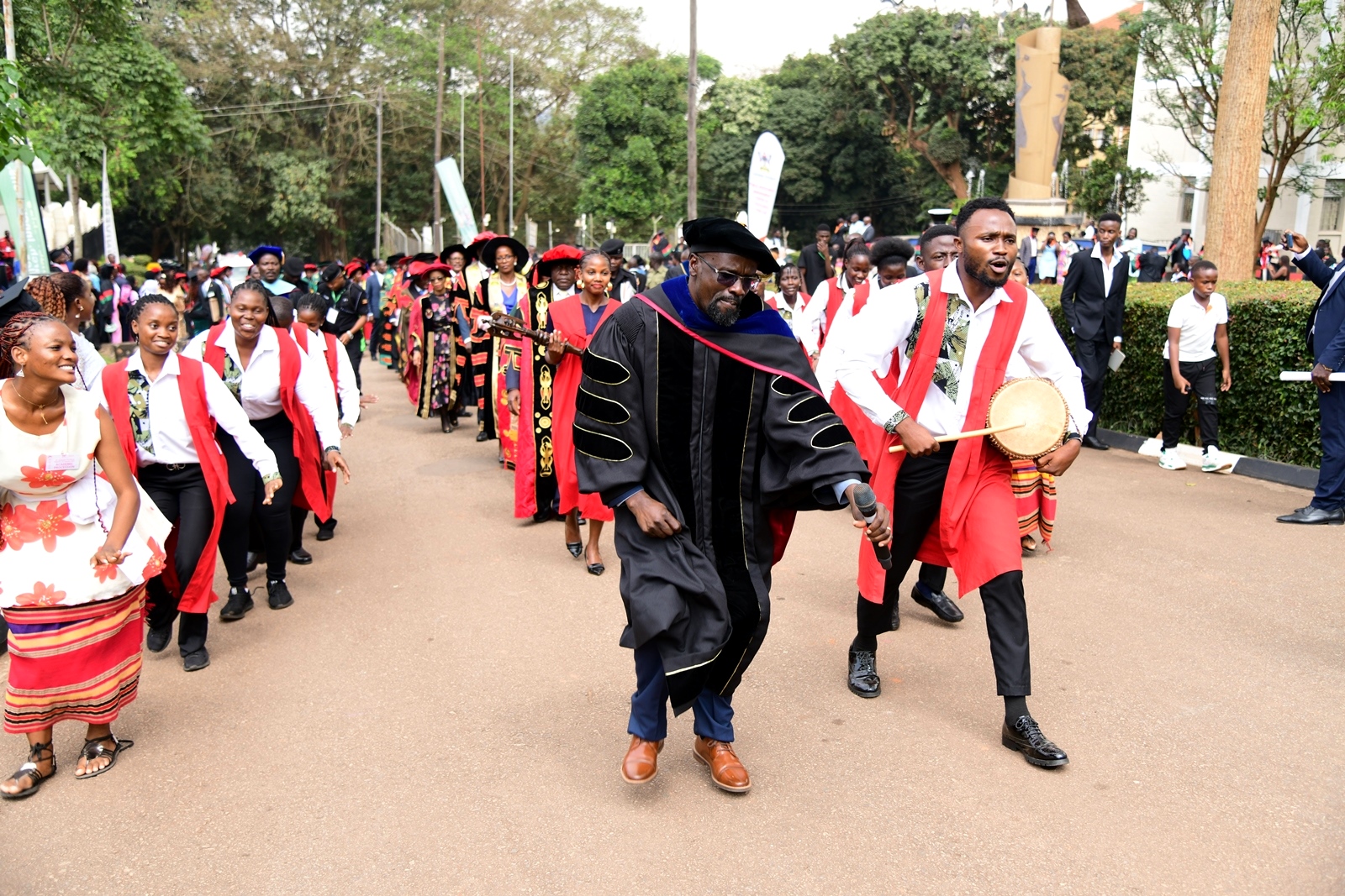 The Department of Performing Arts and Film (PAF) staff and students lead the Academic Procession. 75th Graduation Ceremony, Day 1, CoCIS, CEES, CoVAB and School of Law. 13th January 2025, Freedom Square, Makerere University, Kampala Uganda, East Africa.