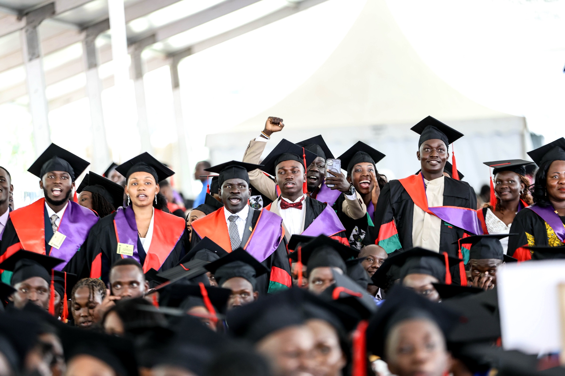 Graduands jubilate during the Mak75thGrad Ceremony. 75th Graduation Ceremony, Day 2, CoBAMS, CHS and CoNAS. 14th January 2025, Freedom Square, Makerere University, Kampala Uganda, East Africa.