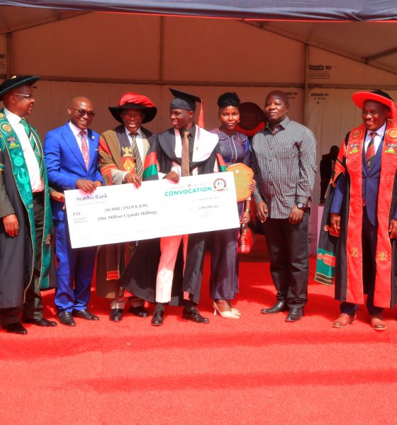 AR-Prof. Buyinza Mukadasi (4th L) and Chair Convocation-Mr. George Turyamureeba (3rd L) present the Award to Mubiru (C) as his parents (3rd & 4th R) as well as CoNAS Principal-Prof. Winston Tumps Ireeta (2nd R) and College Leadership witness. 75th Graduation Ceremony, Day 2, CoBAMS, CHS and CoNAS. 14th January 2025, Freedom Square, Makerere University, Kampala Uganda, East Africa.