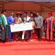 AR-Prof. Buyinza Mukadasi (4th L) and Chair Convocation-Mr. George Turyamureeba (3rd L) present the Award to Mubiru (C) as his parents (3rd & 4th R) as well as CoNAS Principal-Prof. Winston Tumps Ireeta (2nd R) and College Leadership witness. 75th Graduation Ceremony, Day 2, CoBAMS, CHS and CoNAS. 14th January 2025, Freedom Square, Makerere University, Kampala Uganda, East Africa.