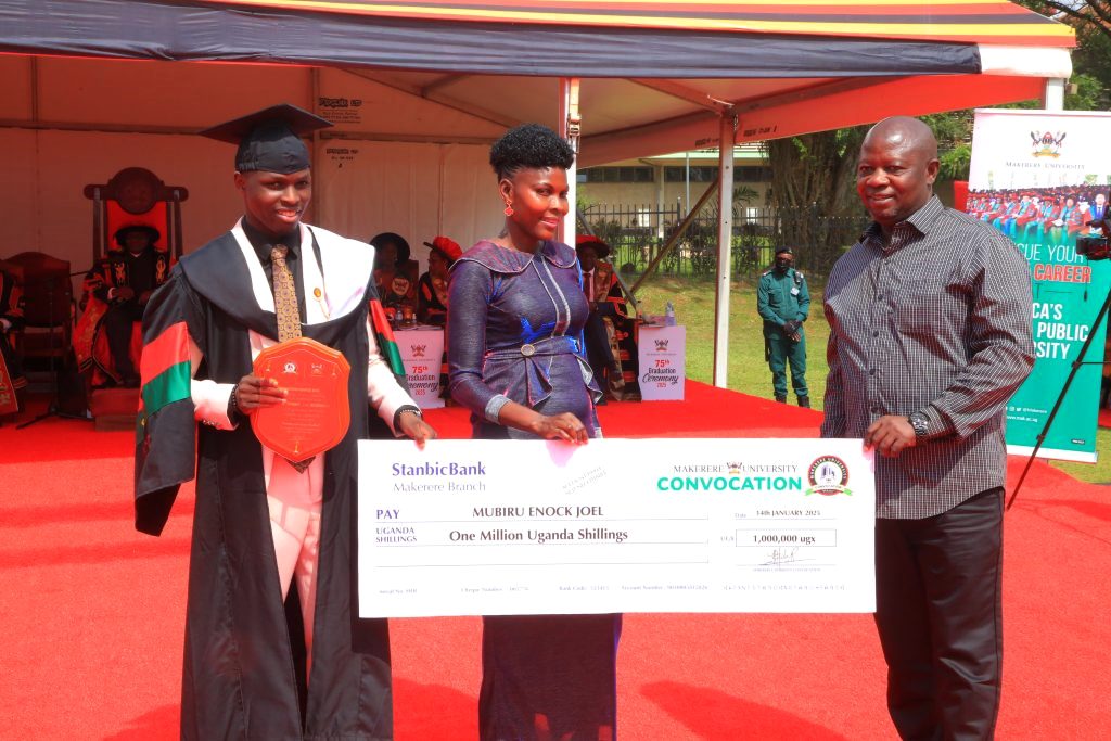 Mubiru with his parents after receiving the award. 75th Graduation Ceremony, Day 2, CoBAMS, CHS and CoNAS. 14th January 2025, Freedom Square, Makerere University, Kampala Uganda, East Africa.