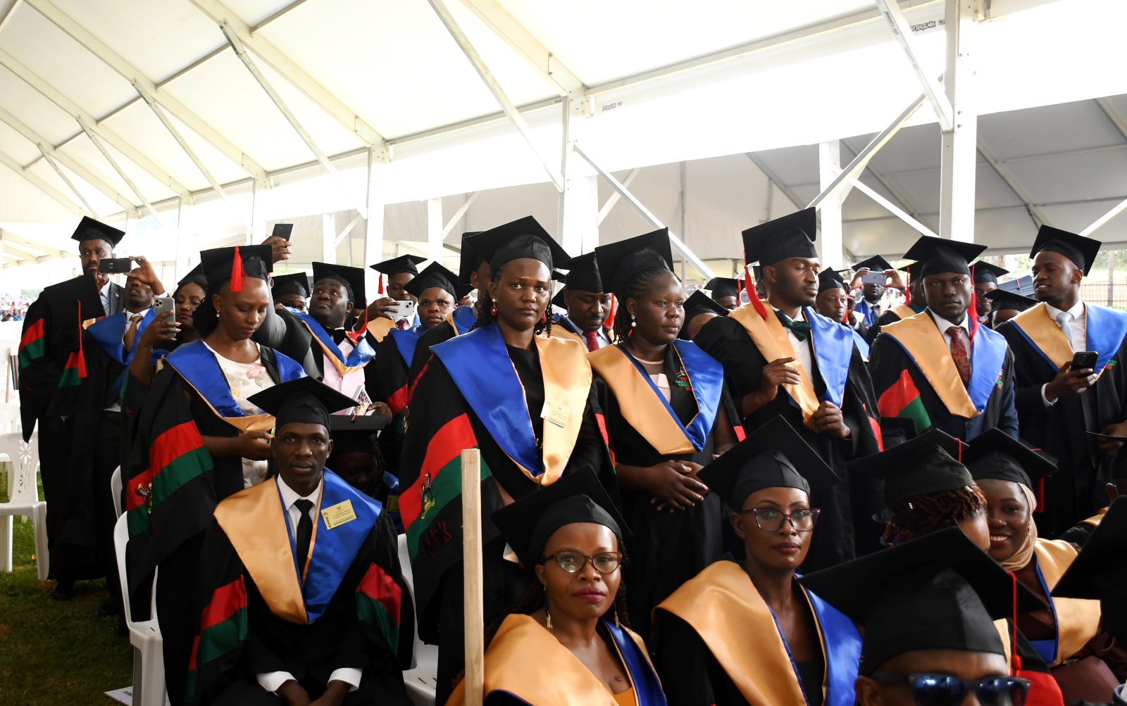 Masters Graduands from CoBAMS follow proceedings. 75th Graduation Ceremony, Day 2, CoBAMS, CHS and CoNAS. 14th January 2025, Freedom Square, Makerere University, Kampala Uganda, East Africa.