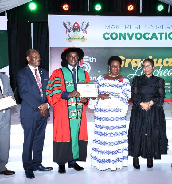 Hon. Dr. Joyce Moriku Kaducu (3rd R) presents the Mid-Career Award to Dr. Ssendawula Kasimu (3rd L) during the Convocation Luncheon. 75th Graduation Ceremony, Day 2, CoBAMS, CHS and CoNAS. 14th January 2025, Research, Teaching, Students Excellence Awards, Edge Road, Makerere University, Kampala Uganda, East Africa.