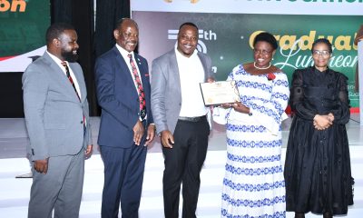 Hon. Dr. Joyce Moriku Kaducu (2nd R) presents the Teacher of the Year Award to Fredrick Kasalirwe (C) during the Convocation Luncheon. 75th Graduation Ceremony, Day 2, CoBAMS, CHS and CoNAS. 14th January 2025, Research, Teaching, Students Excellence Awards, Edge Road, Makerere University, Kampala Uganda, East Africa.