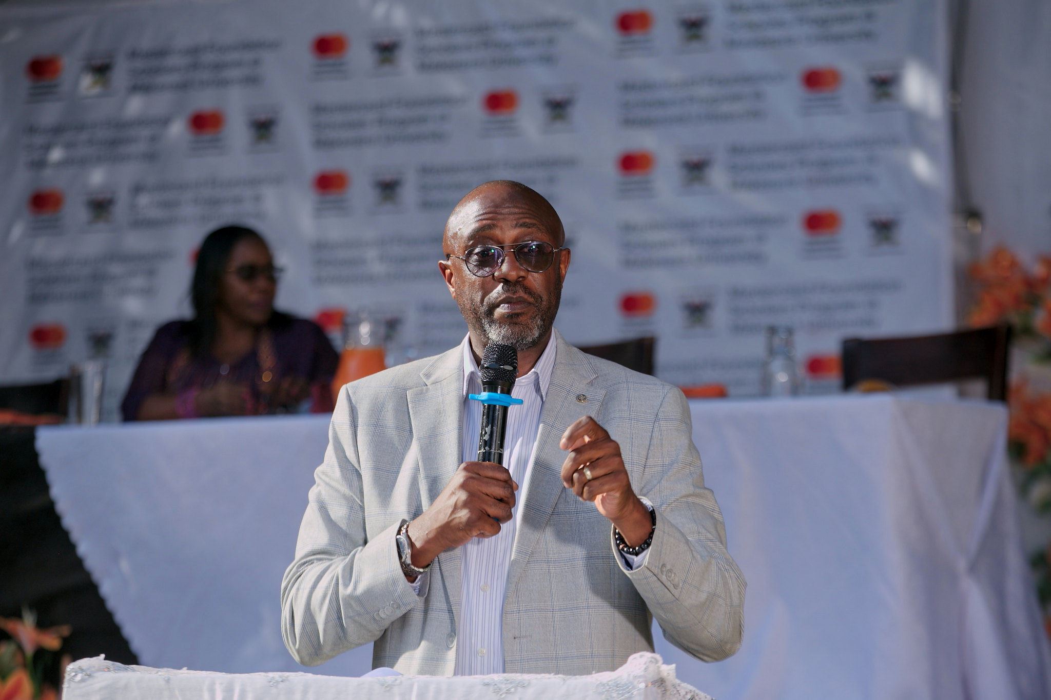 Mr. Adrian Bukenya, the Country Director, Mastercard Foundation-Uganda speaking at the event. 75th Graduation Ceremony, Day 5, CAES, CEDAT and CHUSS. Celebration of completion of 36 Mastercard Foundation Scholars, 17th January 2025, Guest House, Makerere University, Kampala Uganda, East Africa.