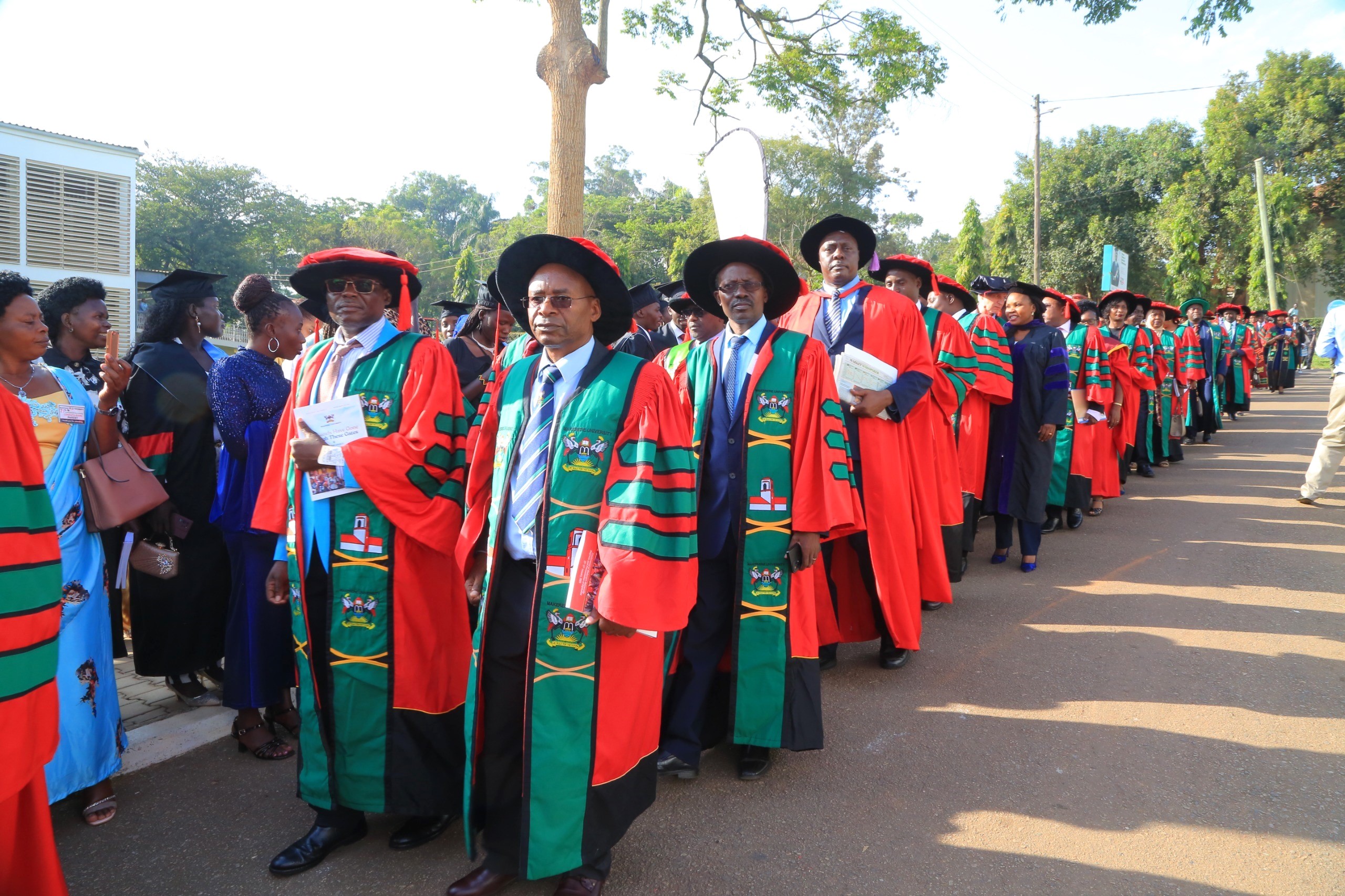 Makerere University faculty from CAES, CEDAT, and CHUSS marching to the Freedom Square for the graduation ceremony. 75th Graduation Ceremony, Day 5, CAES, CEDAT and CHUSS. 17th January 2025, Freedom Square, Makerere University, Kampala Uganda, East Africa.