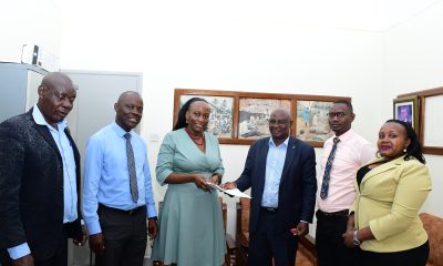 Dean School of Education-Prof. Mulumba Mathias (2nd L), Directorate of Human Resources' Mr. Patrick Mutebi (2nd R), Internal Audit Directorate's Ms. Mbabazi Winnie (R) and another official witness as Dr. John Ssentongo (3rd R) hands over to Dr. Marjorie Batiibwe (3rd L). Department of Science, Technical and Vocational Education (DSTVE), School of Education, College of Education and External Studies (CEES) transition in leadership from Dr. John Ssentongo to Dr. Marjorie Batiibwe, January 28, 2025, Makerere University, Kampala Uganda, East Africa.