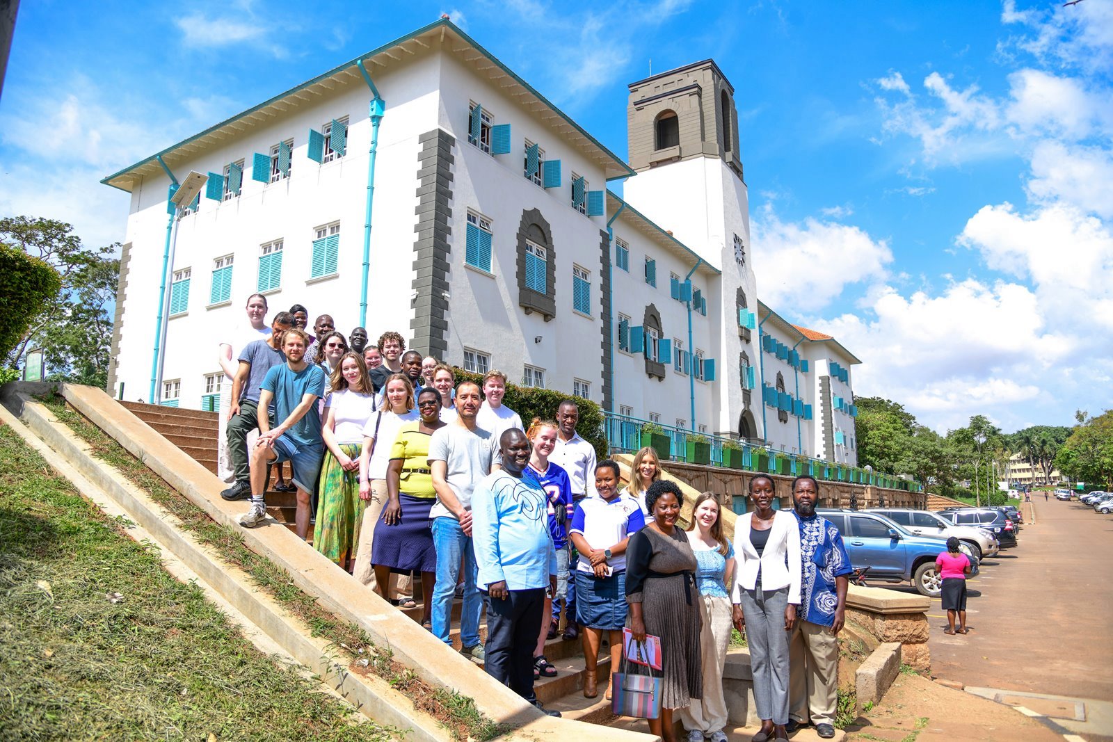 Dr. Harriet Nabushawo, Dr. Joseph Watuleke, Ms. Nuluyati Nalwadda, Dr. Stella Achen and Dr. Oscar Mugula pose for a group photo with the exchange students at the Main Building. Department of Adult and Community Education, School of Distance and Lifelong Learning, College of Education and External Studies (CEES) hosting 17 exchange students from the University of Agder, Norway, as part of a one-month field course. Induction January 6th, 2025, Main Building, Makerere University, Kampala Uganda, East Africa.