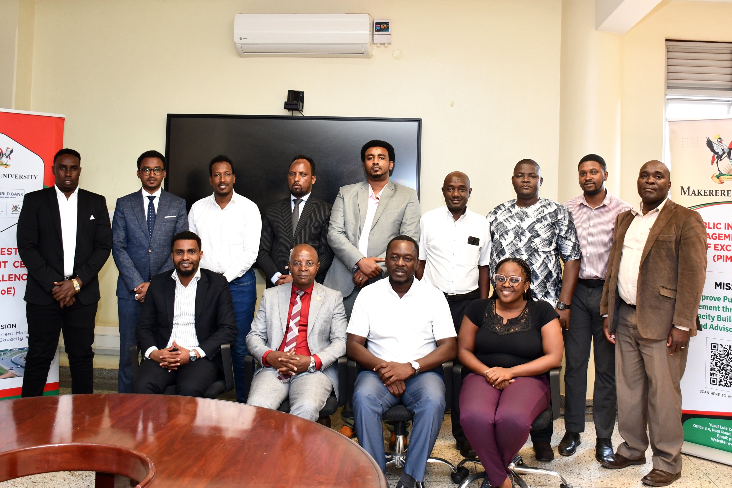 Prof. Edward Bbaale (Seated 2nd Left) with training facilitators and the six Somali Government officials pose for a group photo. Six Somali government officials three-day Executive Training in Infrastructure Asset Management, held at Public Investment Management Centre of Excellence (PIM CoE), College of Business and Management Sciences (CoBAMS), funded by the United Nations Capital Development Fund (UNCDF), 27th-29th January 2025, aimed to enhance regional capacity in infrastructure planning and management, Yusuf Lule Central Teaching, Makerere University, Kampala Uganda, East Africa.