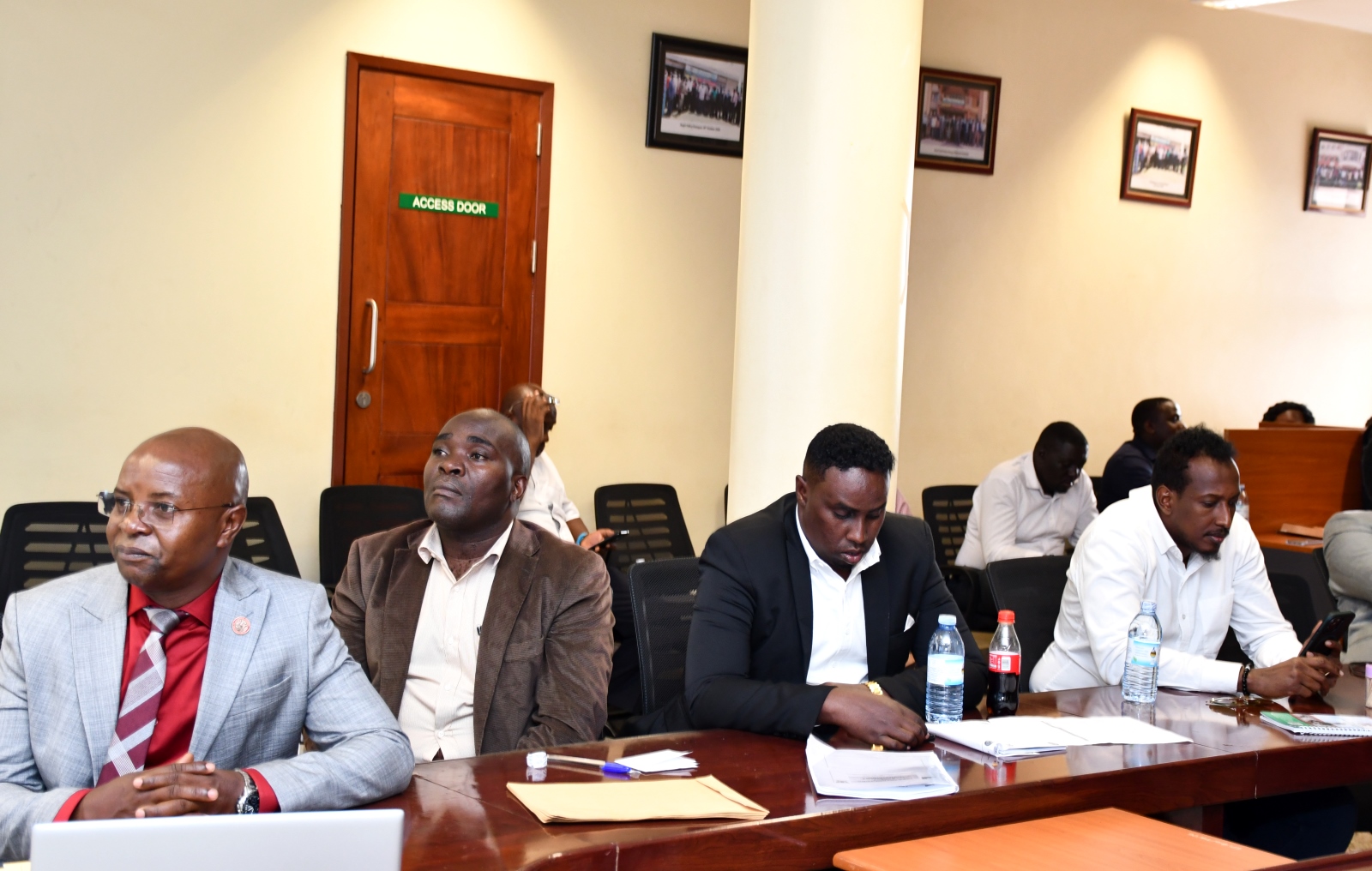 Left to Right: Prof. Edward Bbaale, PIM CoE Manager-Dr. John Sseruyange and some of the officials follow proceedings. Six Somali government officials three-day Executive Training in Infrastructure Asset Management, held at Public Investment Management Centre of Excellence (PIM CoE), College of Business and Management Sciences (CoBAMS), funded by the United Nations Capital Development Fund (UNCDF), 27th-29th January 2025, aimed to enhance regional capacity in infrastructure planning and management, Yusuf Lule Central Teaching, Makerere University, Kampala Uganda, East Africa.