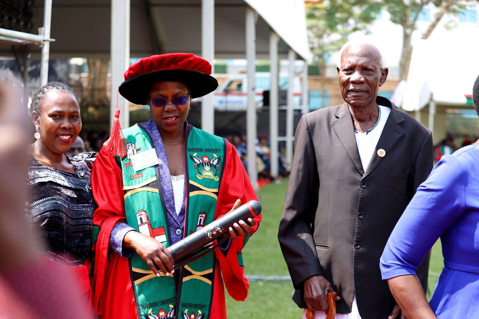 Dr. Achola together with her sister and father, Ms. Evelyn Nyafwono and Mr. Owino Vincent Olele. 75th Graduation Ceremony, Day 2, CoBAMS, CHS and CoNAS. 14th January 2025, Freedom Square, Makerere University, Kampala Uganda, East Africa.