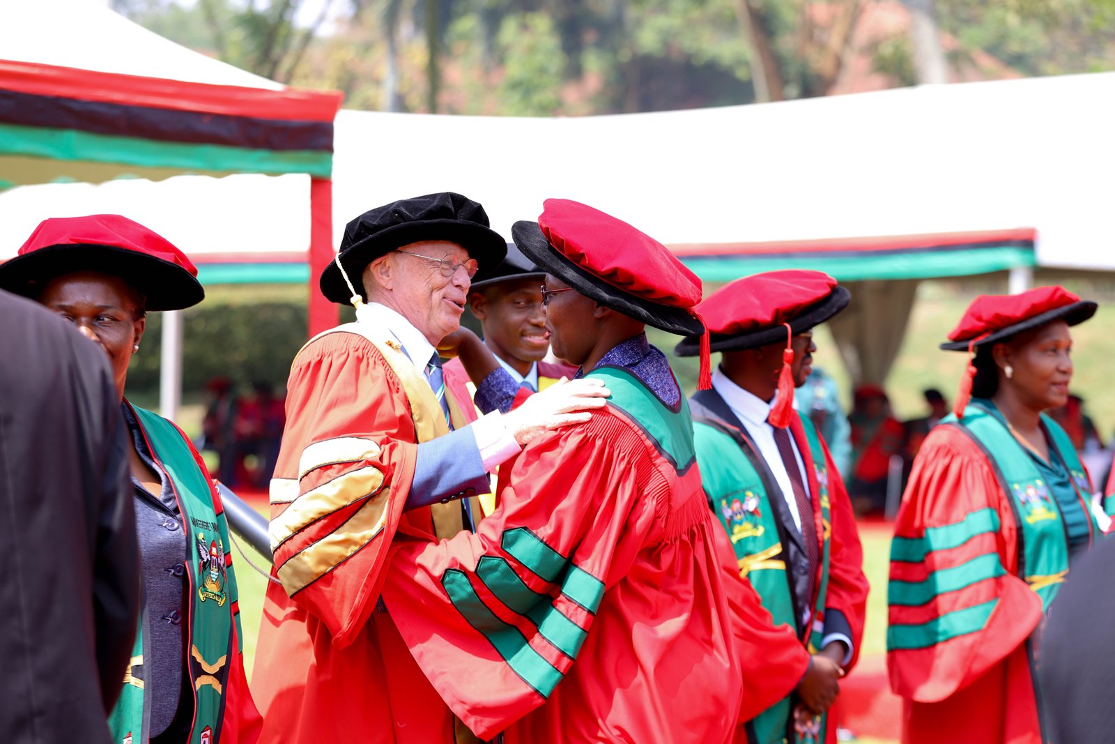 Stefan Swartling Peterson, a Professor of Global Transformations for Health Karolinska Institutet & Makerere Universities also the XChief of Health UNICEF congratulates Dr. Roselline Achola on Graduation day. 75th Graduation Ceremony, Day 2, CoBAMS, CHS and CoNAS. 14th January 2025, Freedom Square, Makerere University, Kampala Uganda, East Africa.