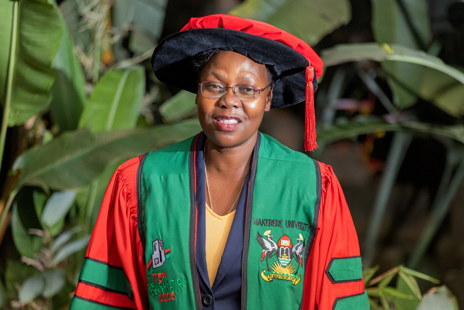 Dr. Roselline Achola adorned in her PhD gown. 75th Graduation Ceremony, Day 2, CoBAMS, CHS and CoNAS. 14th January 2025, Freedom Square, Makerere University, Kampala Uganda, East Africa.