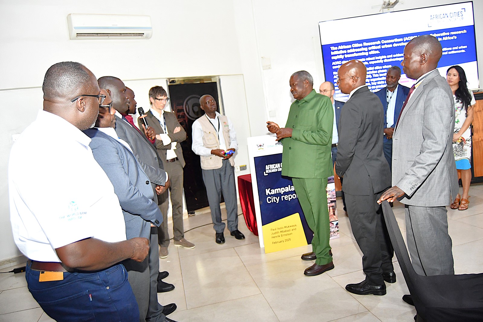 Uganda's Minister of State for Urban Development, Hon. Mario Obiga Kania (in green) officially launched the report. Makerere University Urban Action Lab, College of Agricultural and Environmental Sciences (CAES) launch of comprehensive report, part of the African Cities Research Consortium (ACRC) program, detailing key challenges affecting urban development in Kampala, one of Africa’s fastest-growing cities, annual population growth rate of 5.6%, by Hon. Mario Obiga Kania, Minister of State for Urban Development, 13th February 2025, Fairway Hotel, Uganda, East Africa.