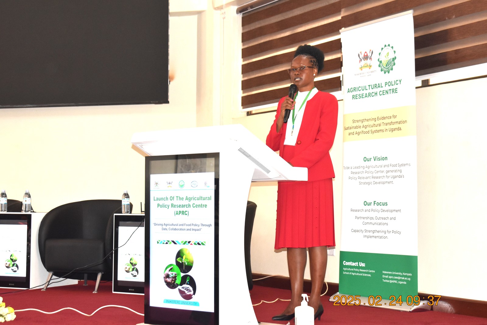 Dr Rosemary Isoto, Head, Department of Agribusiness and Natural Resource Economics, the host unit of the centre addressing participants at the launch. Official launch of Agricultural Policy Research Centre (APRC), College of Agricultural and Environmental Sciences (CAES) by Uganda’s Minister of Agriculture, Animal Industry, and Fisheries (MAAIF), represented by Mr. Steven Byantwale, the Commissioner for Crop Protection, 24th February 2025, Makerere University School of Public Health Auditorium, Kampala Uganda, East Africa.