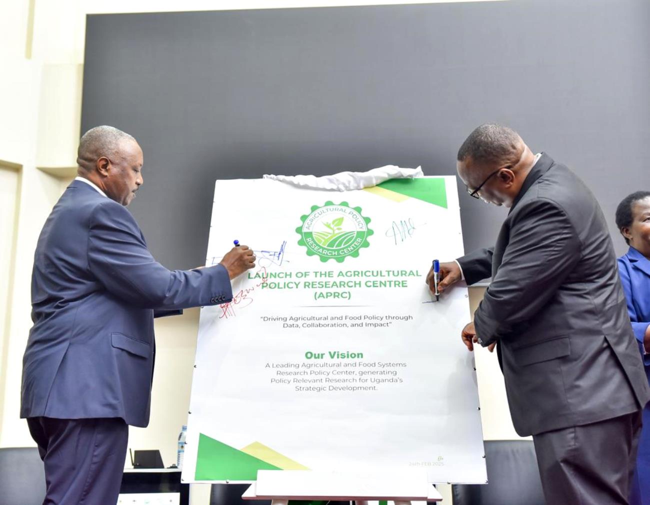 Mr. Steven Byantwale appending his signature in confirmation of the launch of the APRC. Official launch of Agricultural Policy Research Centre (APRC), College of Agricultural and Environmental Sciences (CAES) by Uganda’s Minister of Agriculture, Animal Industry, and Fisheries (MAAIF), represented by Mr. Steven Byantwale, the Commissioner for Crop Protection, 24th February 2025, Makerere University School of Public Health Auditorium, Kampala Uganda, East Africa.