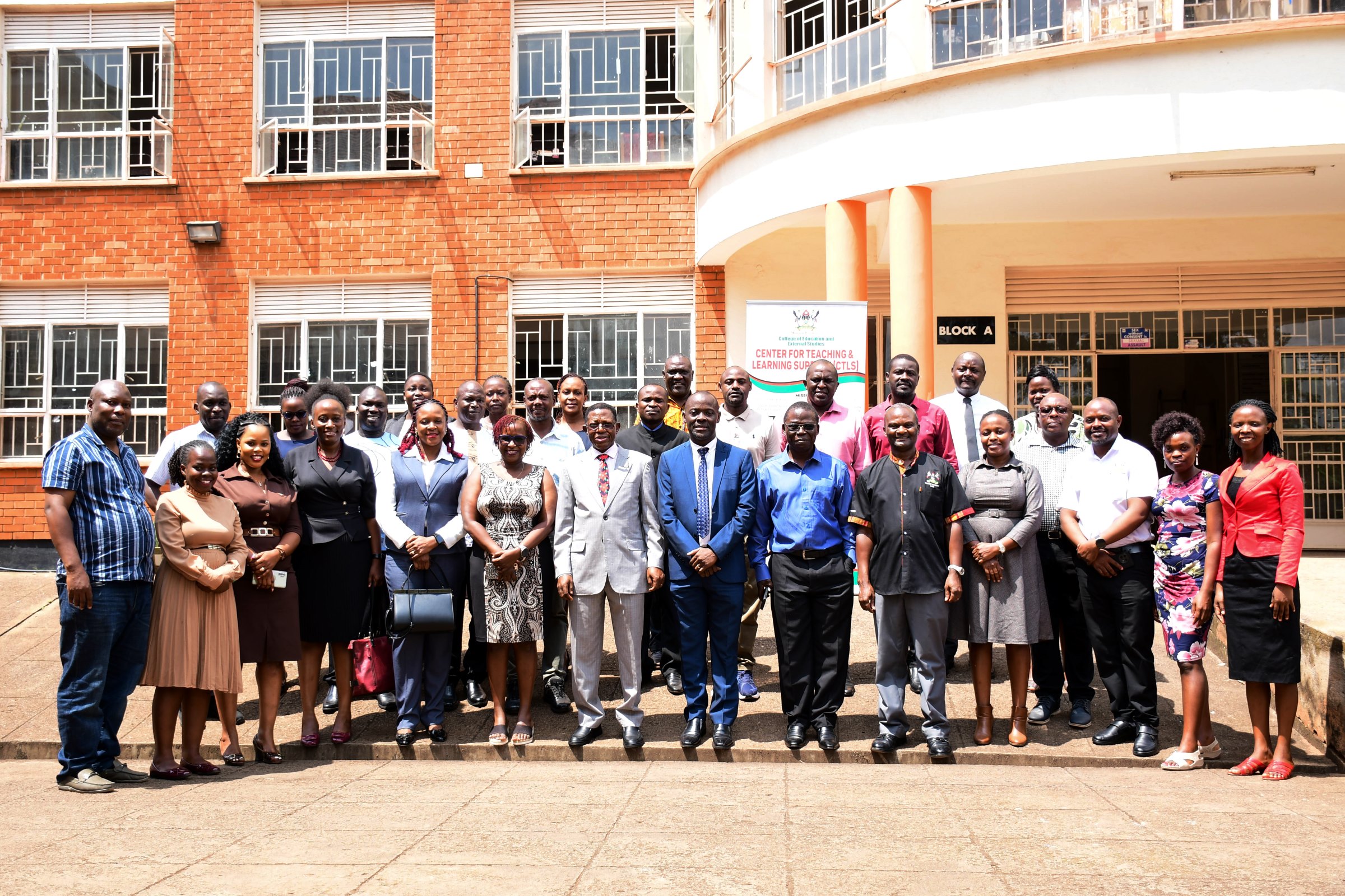 Prof. Buyinza Mukadasi and Prof. Mathias Mulumba (Centre) pose for a group photo with participants after the closing ceremony on 21st February 2025. The Office of the Deputy Vice Chancellor (Academic Affairs) and the College of Education and External Studies (CEES) through the Centre of Teaching and Learning Support (CTLS) are implementing the Pedagogy and Professionalism course, First Cohort of 50, 19th to 21st February 2025, School of Business Conference Room, Makerere University, Kampala Uganda, East Africa.