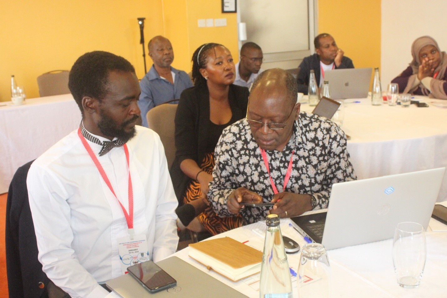 Some of the participants checking a mobile health platform for diagnostics at the workshop. Makerere University in partnership with Glasgow, UK and University of Stockholm, Sweden with support from Europe’s CIVIS  University Alliance, multi-disciplinary workshop "One Health and Diagnosing Zoonoses – Understanding the Importance of Climate Change in Disease Prevalence", at Kabira Country Club, Kampala, Uganda East Africa