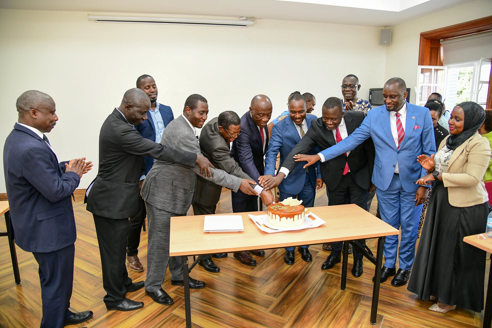 The handover was crowned with cake-cutting. Prof. Henry Alinaitwe officially hands over Office of Deputy Vice Chancellor (Finance and Administration)-DVCFA to Prof. Winston Tumps Ireeta, 20th February 2025, Main Building, Makerere University, Kampala Uganda, East Africa.