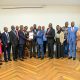 Prof. Buyinza Mukadasi (C), Members of Management and Staff witness as Prof. Henry Alinaitwe presents a copy of his handover report to Prof. Winston Tumps Ireeta. Prof. Henry Alinaitwe officially hands over Office of Deputy Vice Chancellor (Finance and Administration)-DVCFA to Prof. Winston Tumps Ireeta, 20th February 2025, Main Building, Makerere University, Kampala Uganda, East Africa.