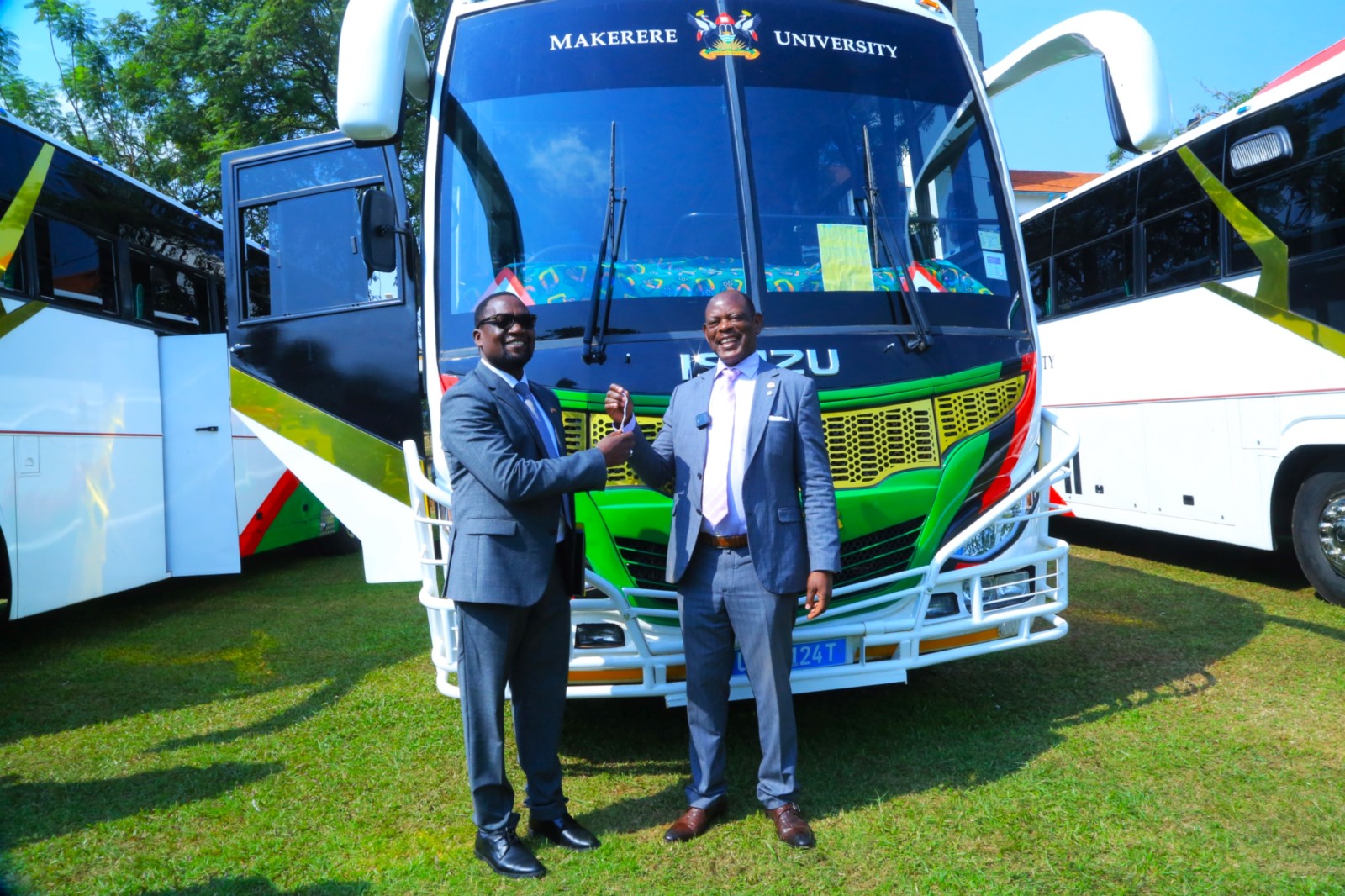 Prof. Barnabas Nawangwe (Right) hands over the keys to CHS Principal-Prof. Bruce Kirenga (Left). Vice Chancellor, Prof. Barnabas Nawangwe hands over three (3) university buses to leadership in the College of Agricultural and Environmental Sciences (CAES), the College of Health Sciences (CHS), and the College of Veterinary Medicine, Animal Resources and Biosecurity (CoVAB) to improve students' practical learning experiences by ensuring reliable transportation for fieldwork and community outreach, 3rd February 2025, Freedom Square, Makerere University, Kampala Uganda, East Africa.