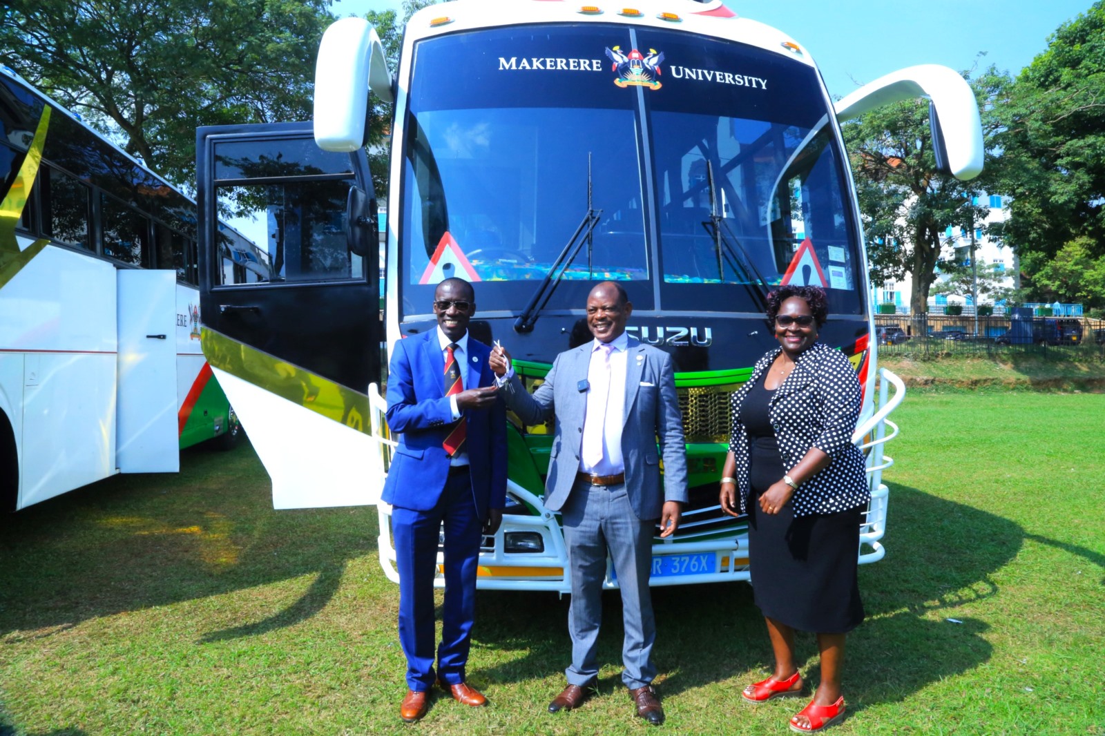 Prof. Barnabas Nawangwe (Centre) hands over the keys to CoVAB Principal-Prof. Frank N. Mwiine (Left) as Dr. Claire Mugasa (Right) witnesses. Vice Chancellor, Prof. Barnabas Nawangwe hands over three (3) university buses to leadership in the College of Agricultural and Environmental Sciences (CAES), the College of Health Sciences (CHS), and the College of Veterinary Medicine, Animal Resources and Biosecurity (CoVAB) to improve students' practical learning experiences by ensuring reliable transportation for fieldwork and community outreach, 3rd February 2025, Freedom Square, Makerere University, Kampala Uganda, East Africa.