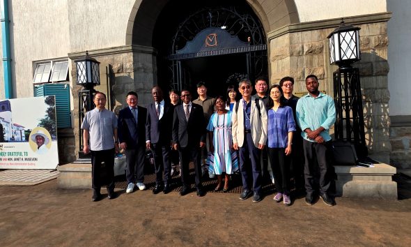 Prof. Buyinza Mukadasi, Prof. Henry Alinaitwe and Prof. Venny Nakazibwe pose for a group photo with members of the delegation at the Main Building entrance. Prof. Henry Alinaitwe, Prof. Buyinza Mukadasi, meeting with project implementation partners from the Korea Institute for Development Strategy (KDS) and the Korea National Open University (KNOU) to discuss the upcoming Project for Enhancing the Distance Education Environment at Makerere University in Uganda (2024-2028), 18th February 2025, Kampala, East Africa.