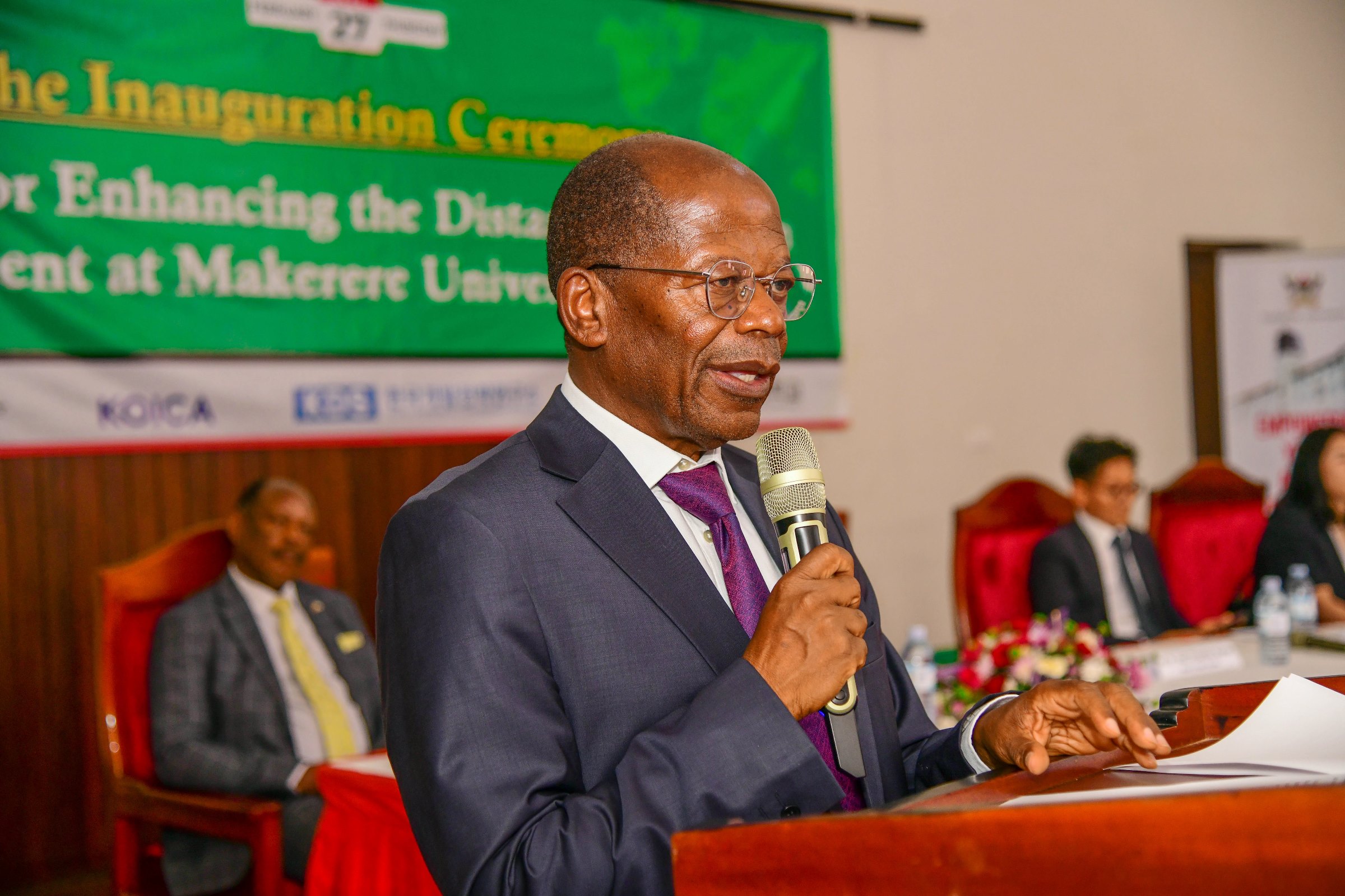 Hon. Dr. John Chrysostom Muyingo delivers his remarks at the launch. Launch of a US$12.2million Korea International Cooperation Agency (KOICA) funded project to enhance the Distance Education Environment by Hon. Dr. John Chrysostom Muyingo, 27th February 2025, Main Hall, Main Building, Makerere University, Kampala Uganda, East Africa.