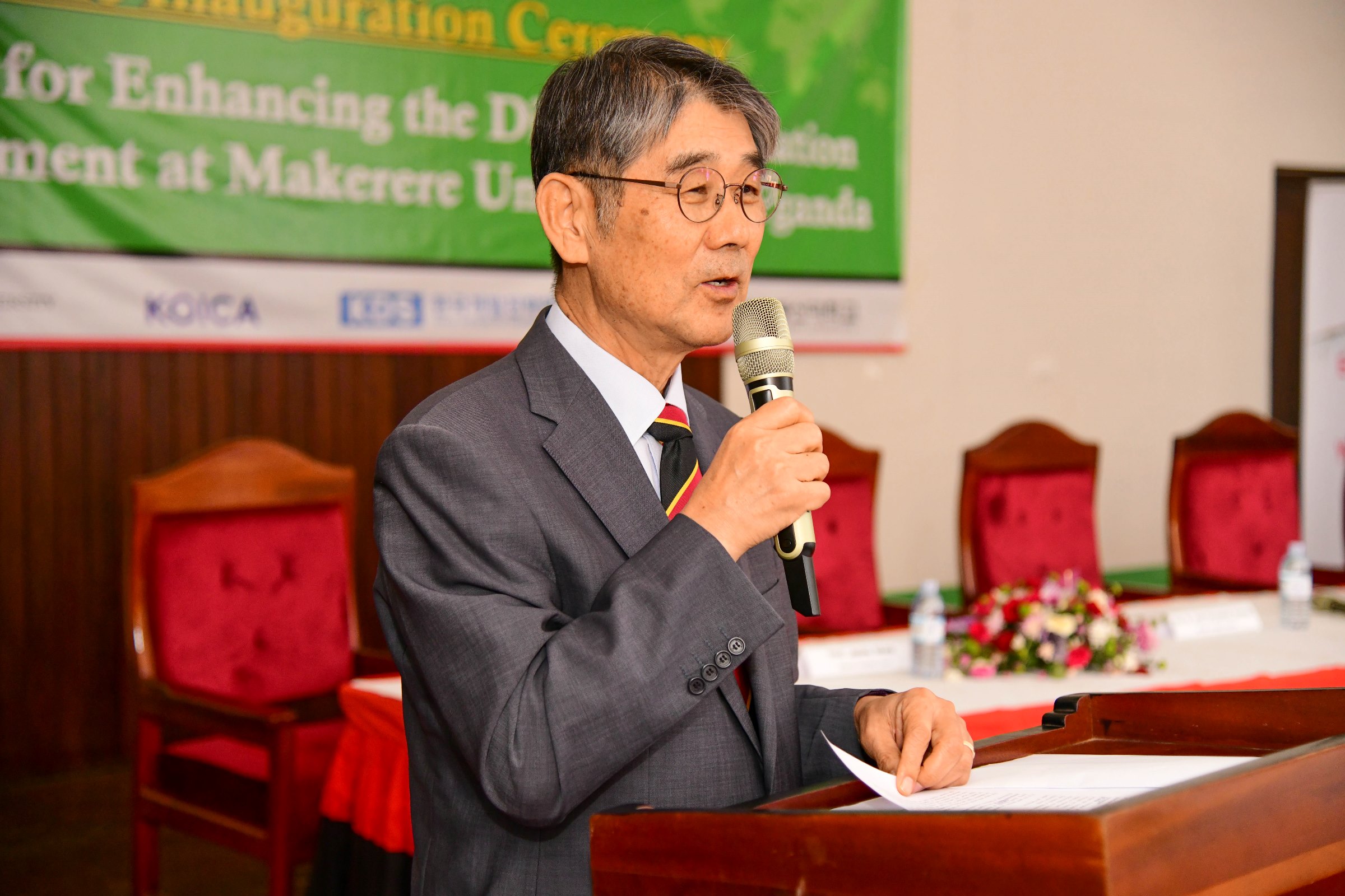 Prof. Chun Seyeoung the Korean PMC Project Manager makes his remarks. Launch of a US$12.2million Korea International Cooperation Agency (KOICA) funded project to enhance the Distance Education Environment by Hon. Dr. John Chrysostom Muyingo, 27th February 2025, Main Hall, Main Building, Makerere University, Kampala Uganda, East Africa.