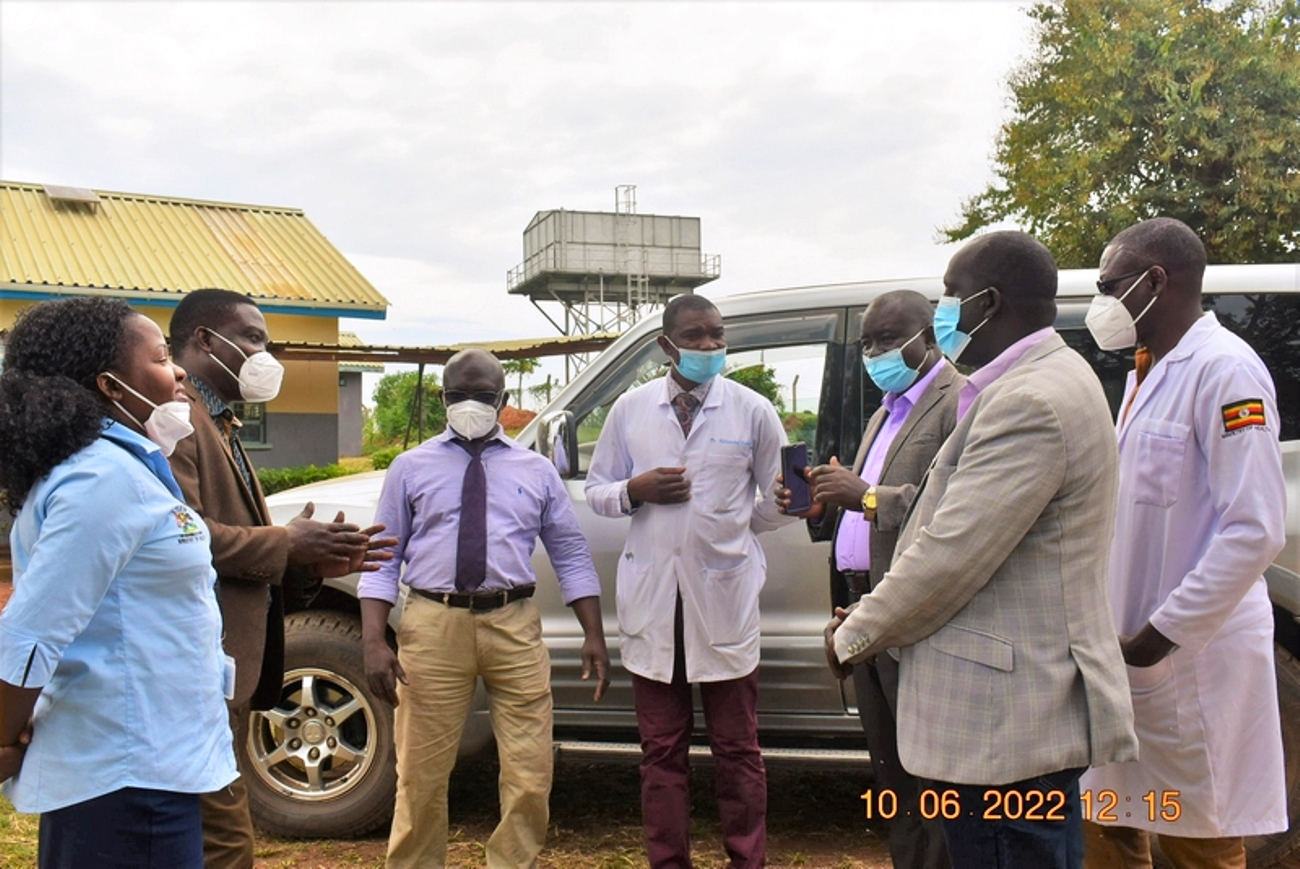 District leaders pose with the RMNCAH mentors outside Ntuusi Health Centre discussing how to improve the services at the facility. Team from the Ministry of Health, and Makerere University, Kampala visit Ntuusi Health Centre IV in Sembabule district, Uganda, East Africa to follow-up on a mentorship training that was done a month earlier by Makerere University under the RMNCAH (Reproductive, Maternal, Neonatal, Child and Adolescent Health) Project.