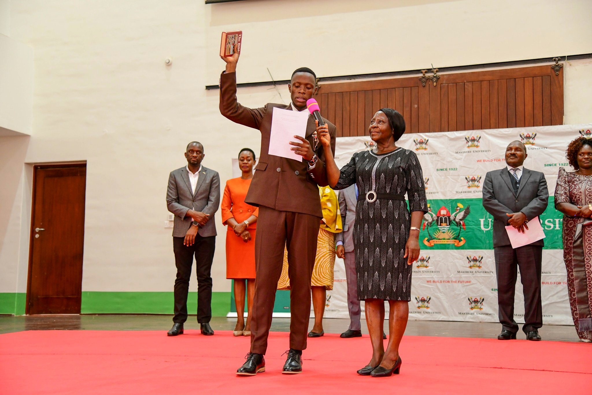 H.E. Ssentamu Churchill James takes oath as 91st Guild President of Makerere University. Ssentamu Churchill James and Kadondi Gracious inaugurated as the 91st Guild President and Vice President, 21st March 2025, Main Hall, Main Administration Building, Makerere University, Kampala Uganda, East Africa.