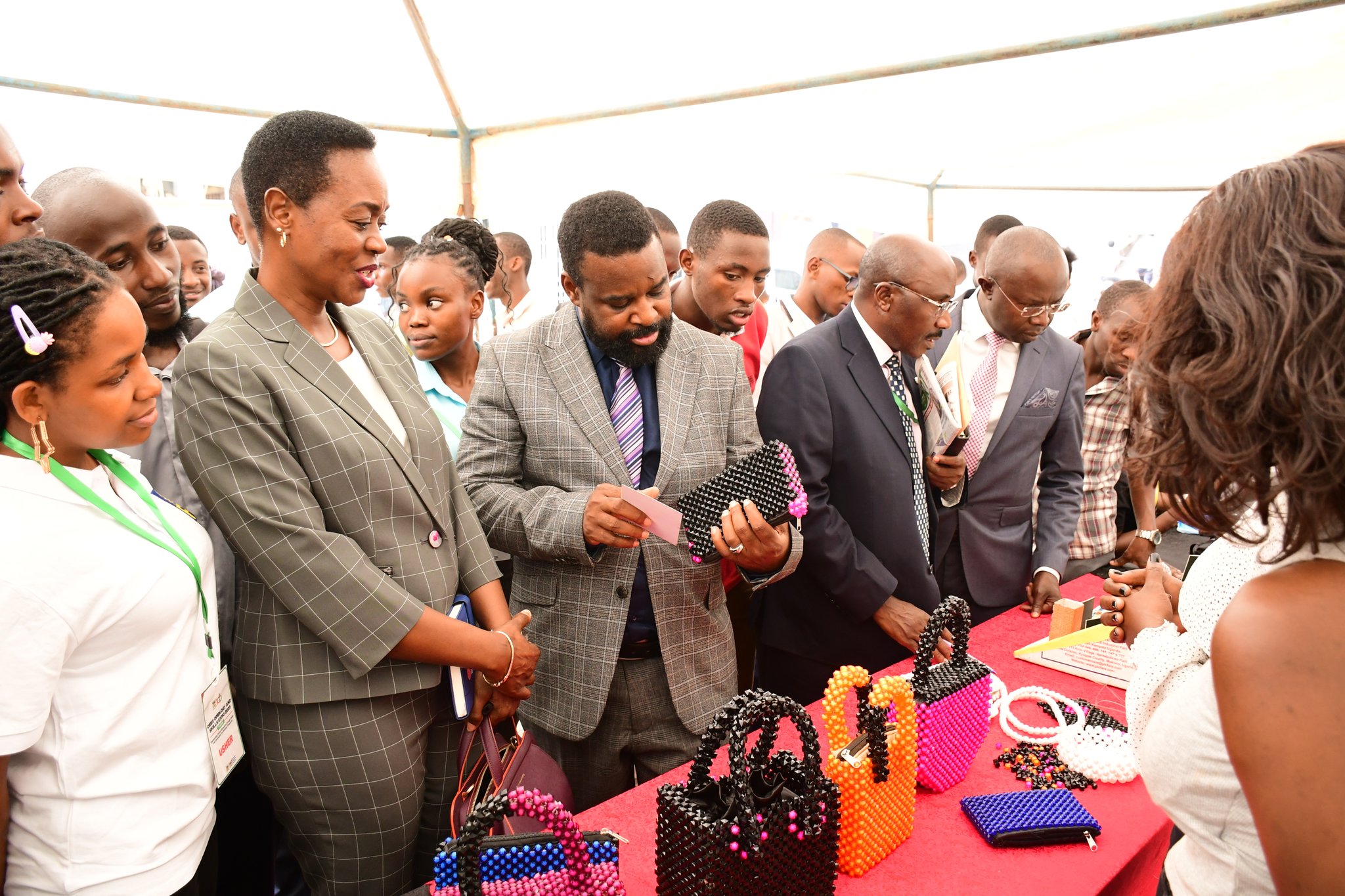 Left to Right: A CEES Official, Dr. Winifred Kabumbuli, Prof. Robert Wamala, Dr. Wilson Ssabavuma and Dr. Muhammad Kiggundu Musoke inspect products by student exhibitors on 14th March 2025. College of Education and External Studies (CEES) Open Day and Skills Expo, theme: "Empowering Future Educators Through Skills and Innovation for National Prosperity", 14th March 2025, Yusuf Lule Central Teaching Facility Auditorium, Makerere University, Kampala Uganda, East Africa.