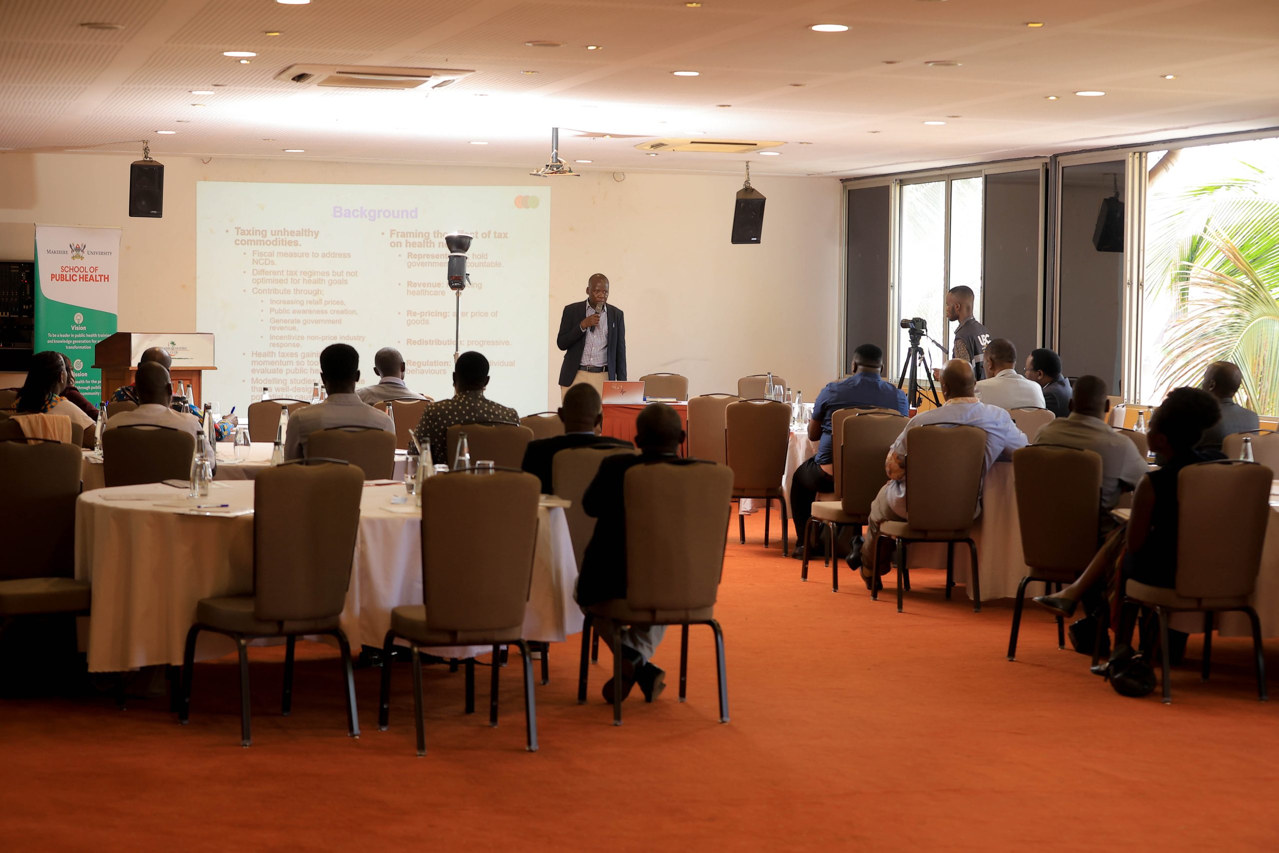 Dr. Eric Segujja, a public health systems researcher at at Makerere University School of Public Health (MakSPH) presents results of the political economy analysis of health taxes on unhealthy commodities in Uganda research. Makerere University School of Public Health (MakSPH), Kampala Uganda, East Africa.