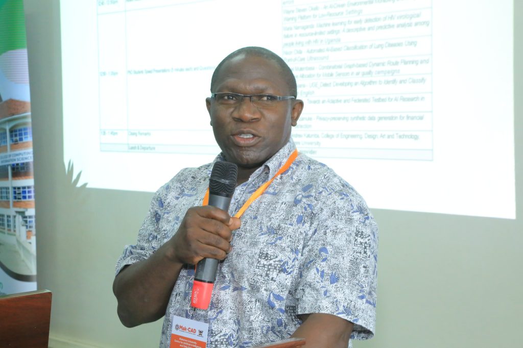 The Dean, School of Computing and Informatics Technology, Dr. Joseph Kibombo Balikuddembe delivering his remarks. Official launch of the Makerere University Centre for Artificial Intelligence and Data Science (Mak-CAD), a hub dedicated to advancing AI research and innovation for Africa’s development. Theme: “Building Responsible AI Research and Innovations for Impact,” 13th March 2025, College of Computing and Information Sciences (CoCIS), Block B, Kampala Uganda, East Africa.