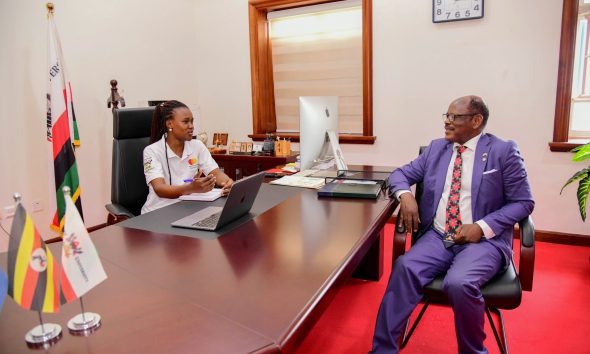 Prof. Barnabas Nawangwe (Right) listens to Elizabeth Gabeya (seated at his desk) during the unforgettable experience. 21-year-old Elizabeth Gabeya, a Bachelor of Agricultural and Rural Innovation First Year Mastercard Foundation Scholar at Makerere University, takes charge of the Vice Chancellor's office for two days- March 10th and 11th 2025, Main Building, Kampala Uganda, East Africa.