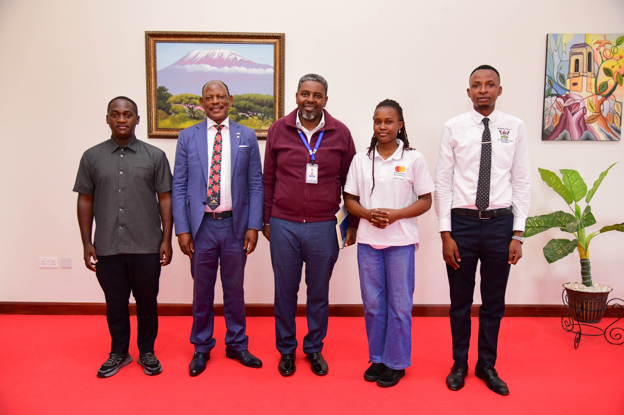 Elizabeth Gabeya (2nd Right) poses for a group photo with Prof. Barnabas Nawangwe (2nd Left) and other officials after a meeting. 21-year-old Elizabeth Gabeya, a Bachelor of Agricultural and Rural Innovation First Year Mastercard Foundation Scholar at Makerere University, takes charge of the Vice Chancellor's office for two days- March 10th and 11th 2025, Main Building, Kampala Uganda, East Africa.