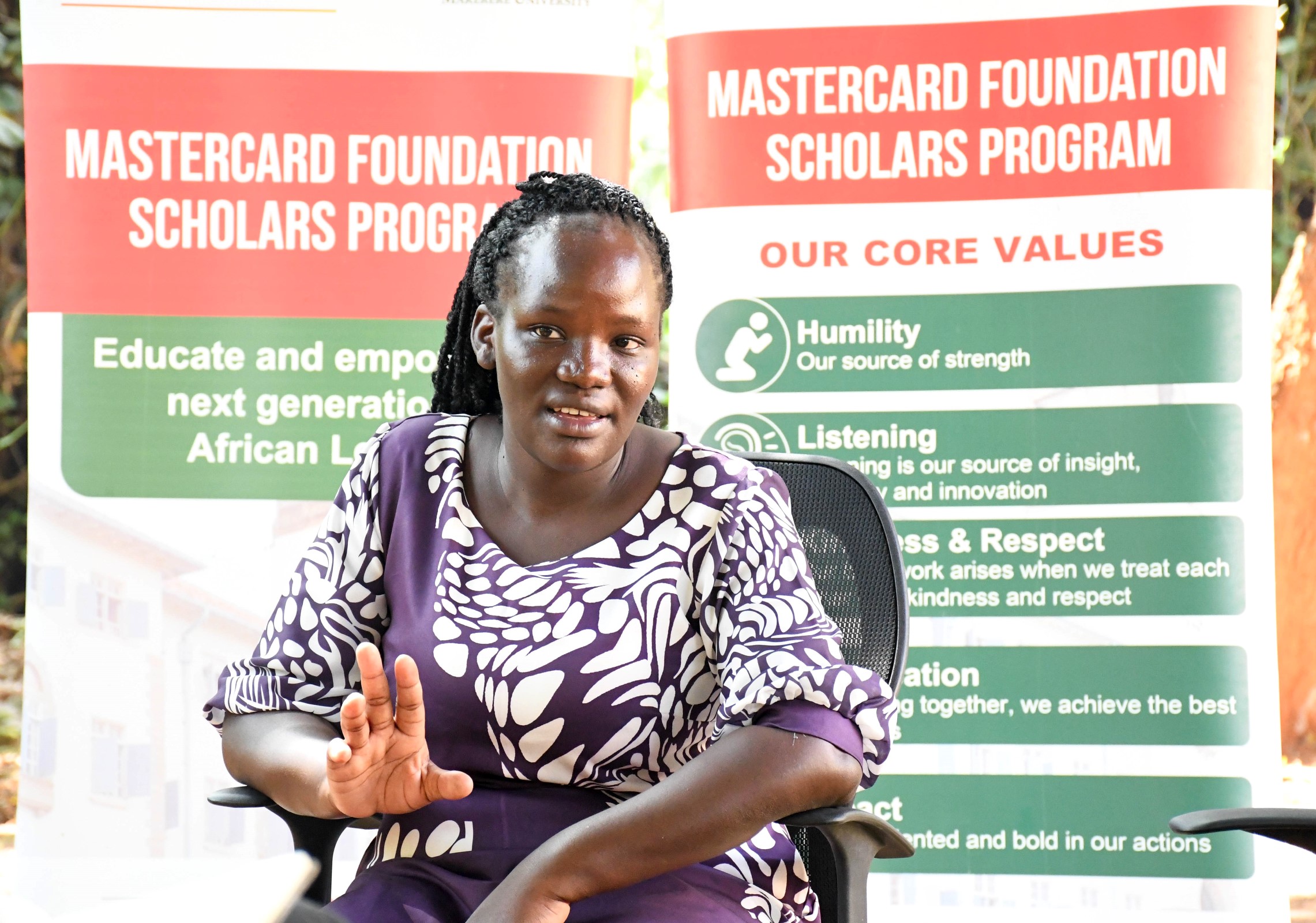 Winnie Kushaba emphasising a point during a recent interview at Makerere University. Mastercard Foundation Scholars Program at Makerere Univeristy alumna Winnie Kushaba, born in Rakai District, moved between Rakai, Ibanda, Kiruhura, Kazo, and Isingiro, searching for a place to call home, graduated with the Bachelor of Science degree in Botany and Chemistry in 2021, holds the dual roles of Product Development Manager and Internal Control Systems Manager at Bio Fresh Ltd, Kampala Uganda, East Africa.