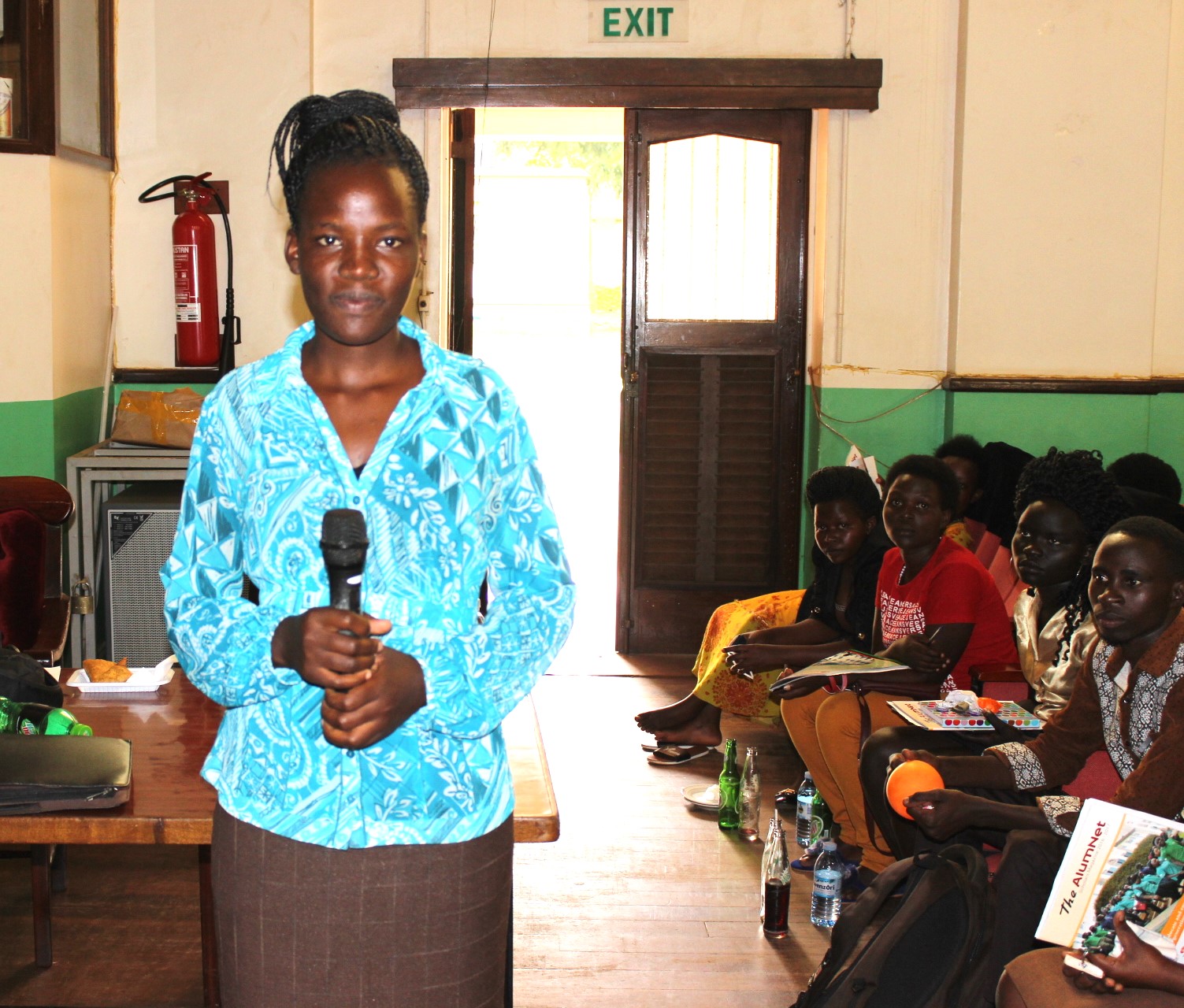 Winnie asking questions during her orientation at Makerere University. Mastercard Foundation Scholars Program at Makerere Univeristy alumna Winnie Kushaba, born in Rakai District, moved between Rakai, Ibanda, Kiruhura, Kazo, and Isingiro, searching for a place to call home, graduated with the Bachelor of Science degree in Botany and Chemistry in 2021, holds the dual roles of Product Development Manager and Internal Control Systems Manager at Bio Fresh Ltd, Kampala Uganda, East Africa.