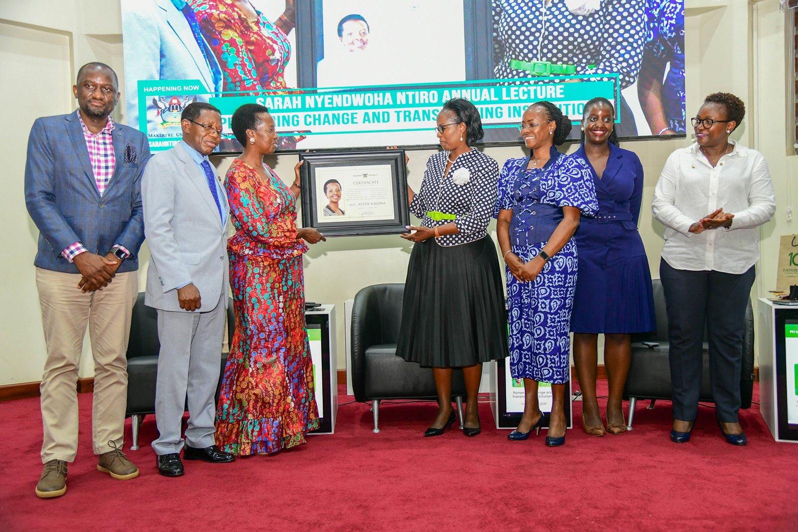 Mrs. Lorna Magara (Centre) presents a plaque to Mrs. Allen Kagina (3rd Left) in appreciation of her keynote address. 3rd Sarah Nyendwoha Ntiro Annual Public Lecture, theme: “Pioneering change and transforming Institutions”, Kenyote Speaker: Mrs. Allen Kagina, 7th March 2025, School of Public Health Auditorium, Makerere University, Kampala Uganda, East Africa.