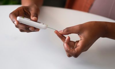 High angle woman checking glucose levels. Photo courtesy of Freepik. Makerere University School of Public Health (MakSPH), Kampala Uganda, East Africa.