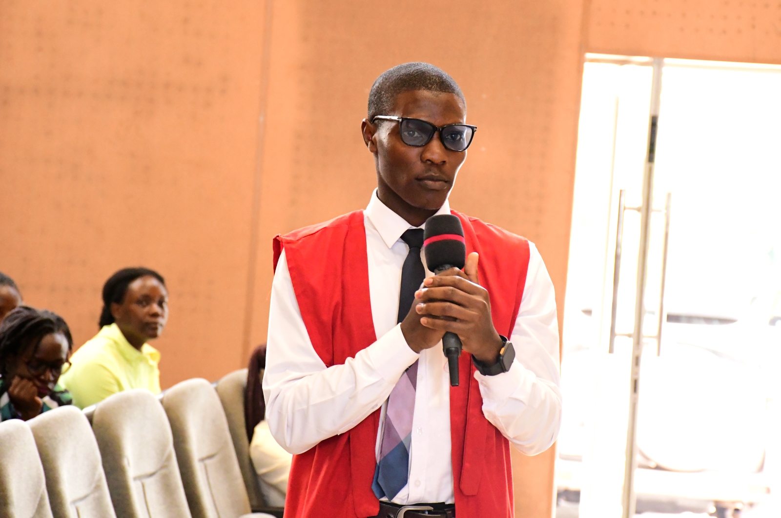Mr. Swaibuh Damulira, President of the Makerere University Economics Students Society giving a vote of thanks. Bank of Uganda in partnership with College of Business and Management Sciences (CoBAMS) career talk targeting students studying economics. Theme: ‘Beyond the Books-Positioning Economics Students for National and Global Relevance,’ Commits to Annual Monetary policy engagements, 14th April 2025, Yusuf Lule Central Teaching Facility Auditorium, Makerere University, Kampala Uganda, East Africa.