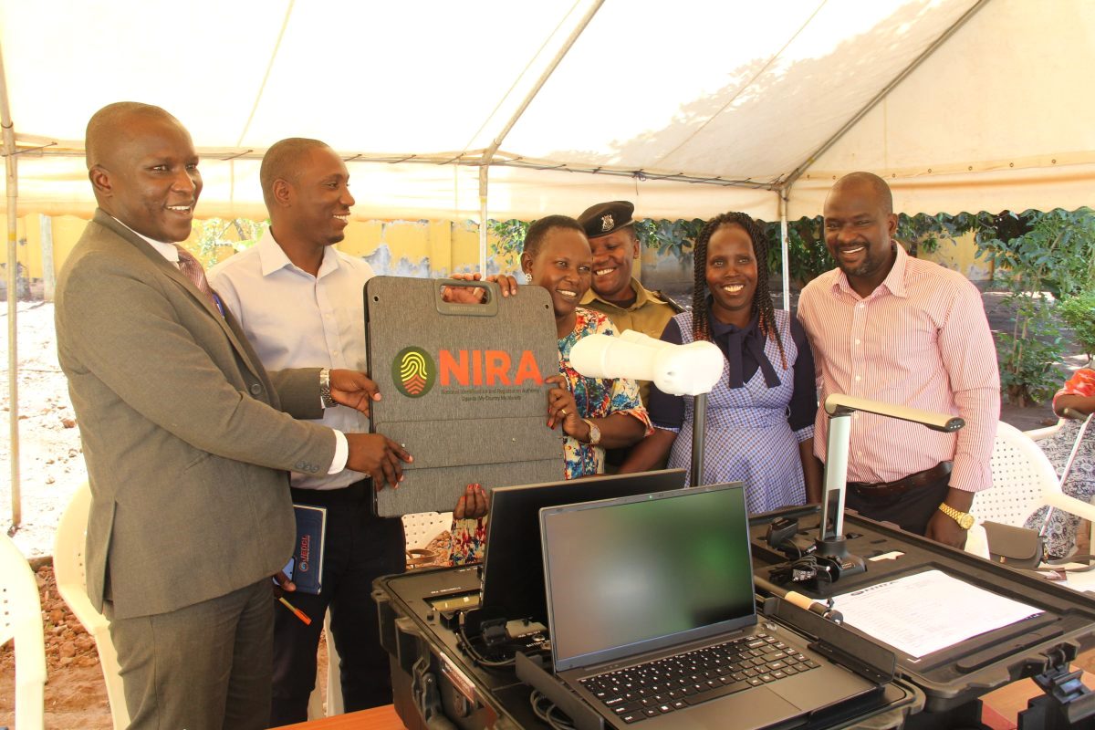 Joan Apio, Deputy RDC Apac, officiated over the unpacking, recipient, and handover of NIRA kits supplied for mass enrollment and renewal of National IDs at the NIRA Office Apac Branch on March 13, 2025.